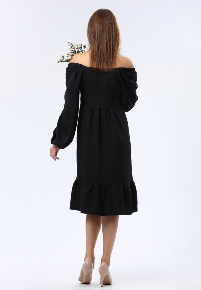 Чорна сукня вільного крою з широким воланом 5749